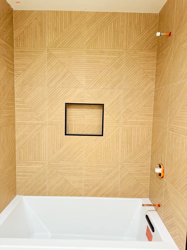 Modern geometric shower wall tile installation in los Angeles by Mingos stone tile