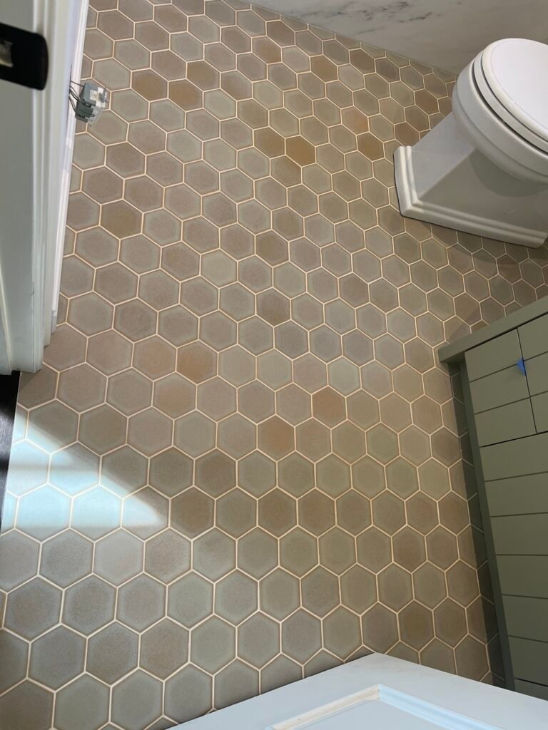 Hexagonal bathroom floor tile installation in los Angeles by Mingos Stone tile